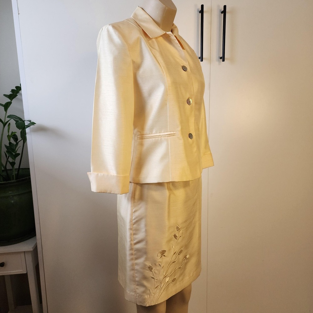 1980s yellow two piece suit set with embroidered floral design on skirt